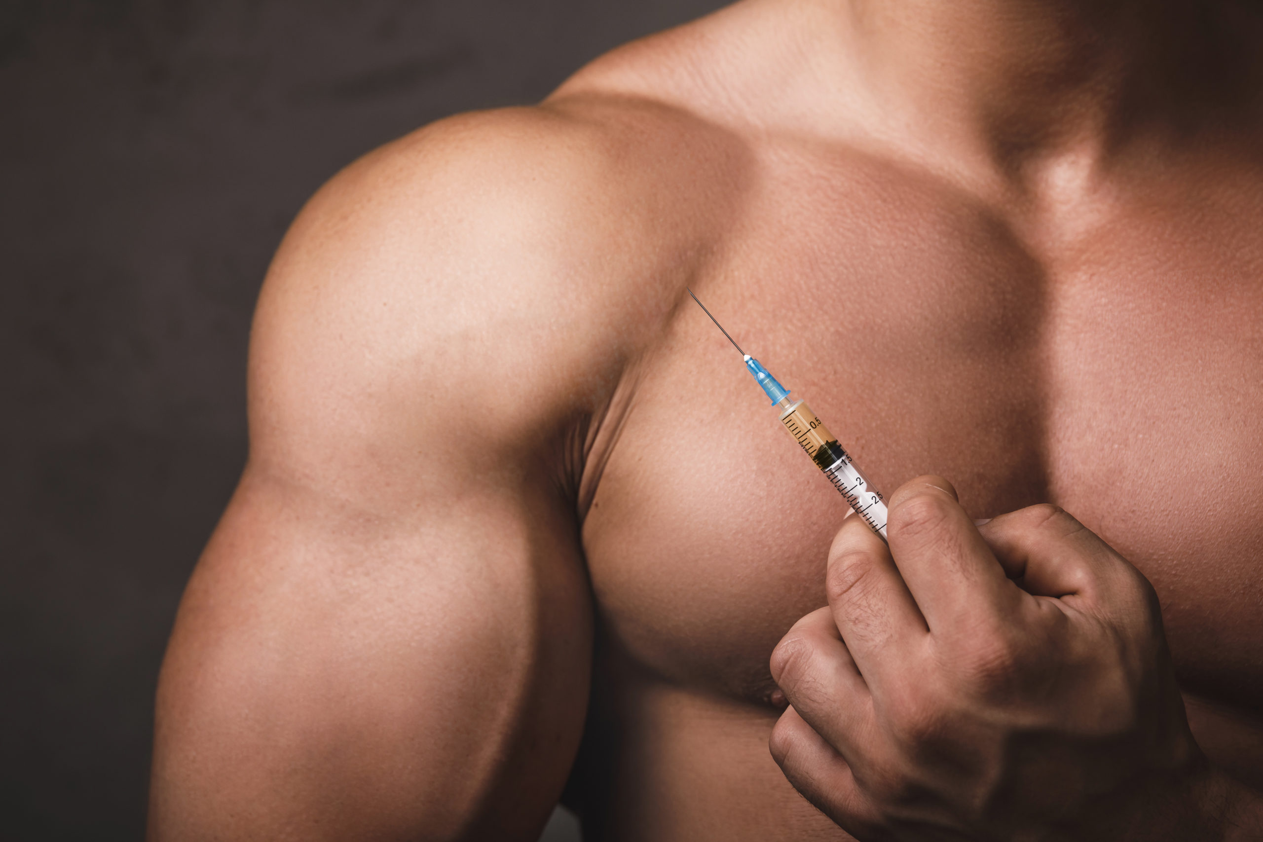 male injects into shoulder