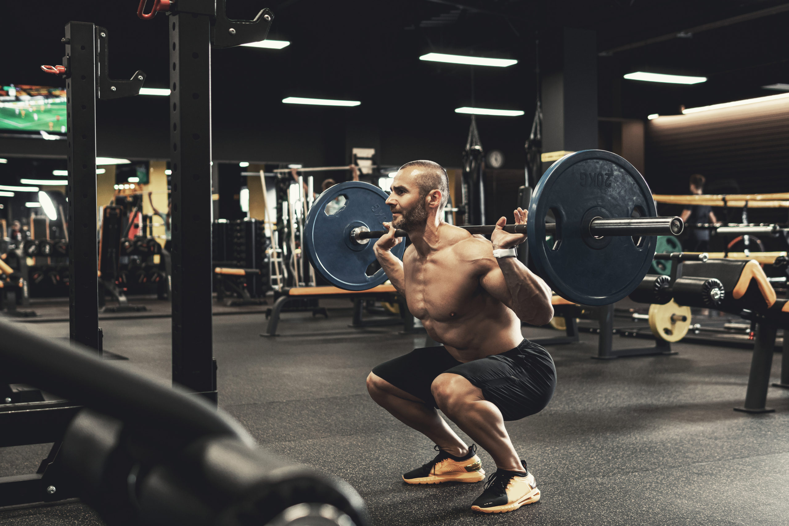 man doing squat workout